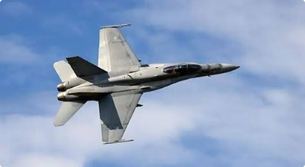 fighter jet flying though air