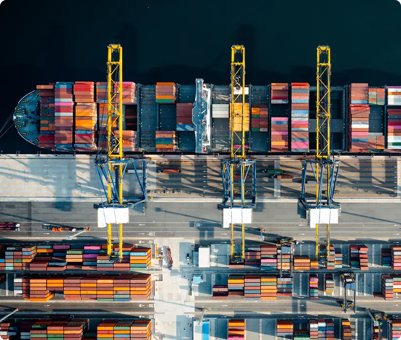 aerial view of cargo ship at loading dock